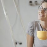 Lady relaxing after installing wireless interconnected photoelectric smoke alarms