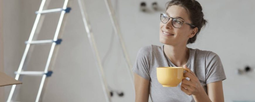 Lady relaxing after installing wireless interconnected smoke alarms